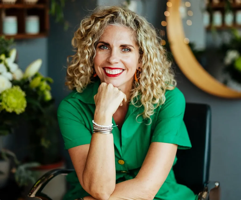 Anna Balcombe, curl specialist, smiling in her salon